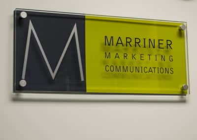 Marriner Marketing logo sign