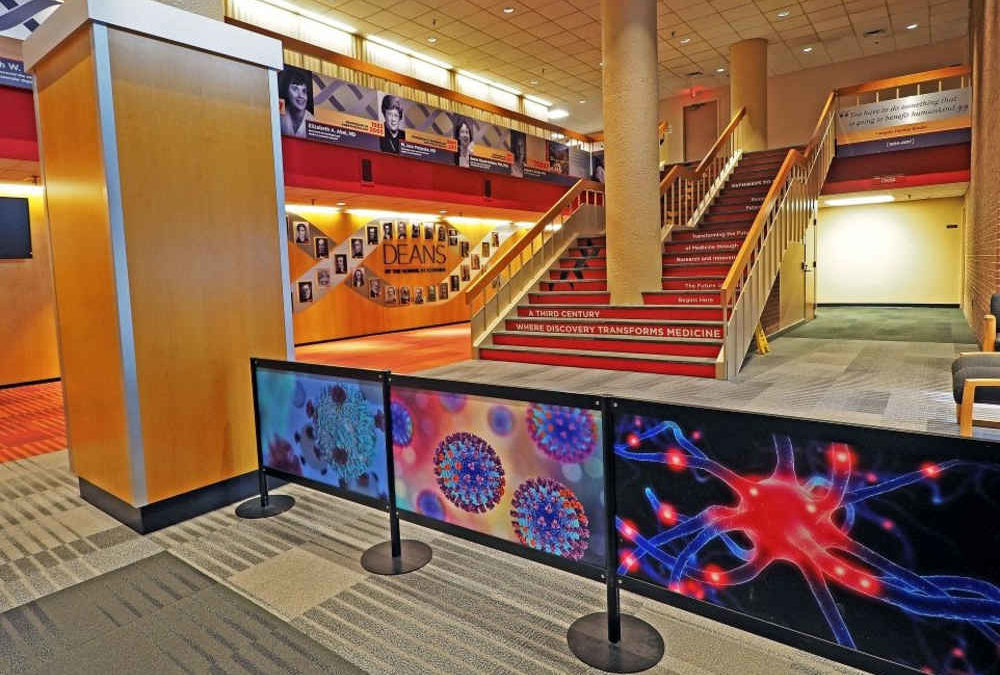 Crowd control stanchions with custom acrylic graphic infills.