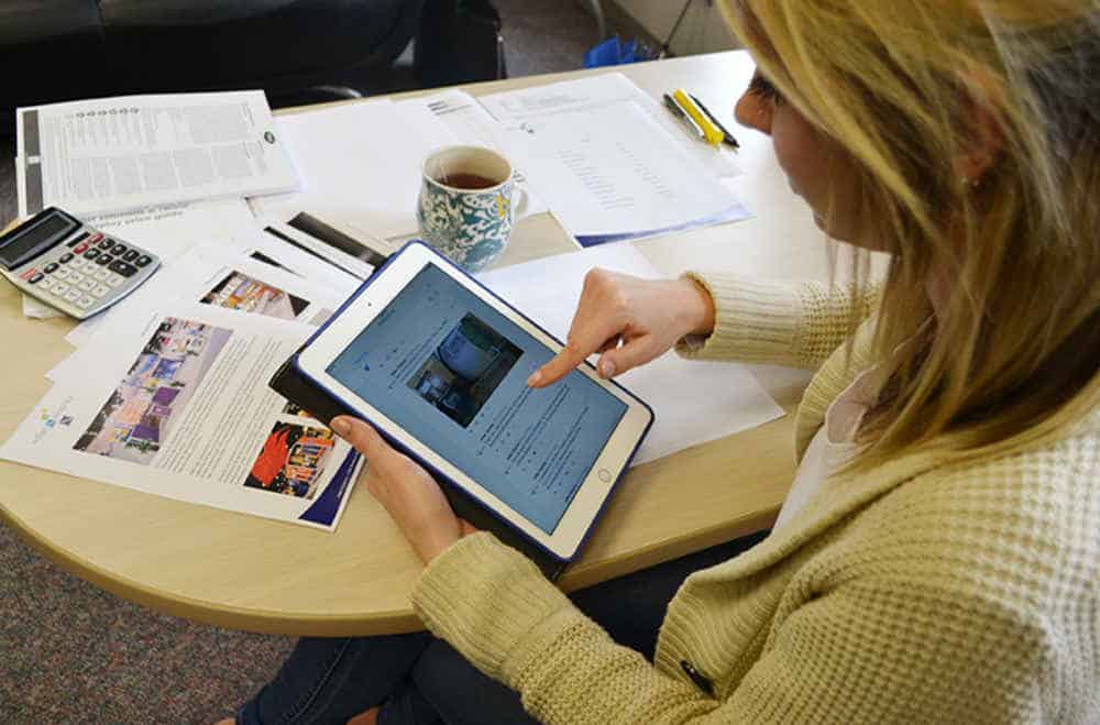 woman browsing social media on a tablet